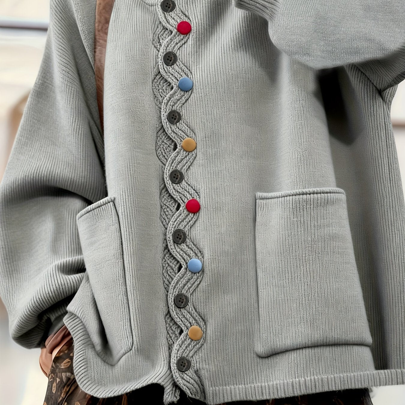 Gray cardigan with colorful buttons and textured trim