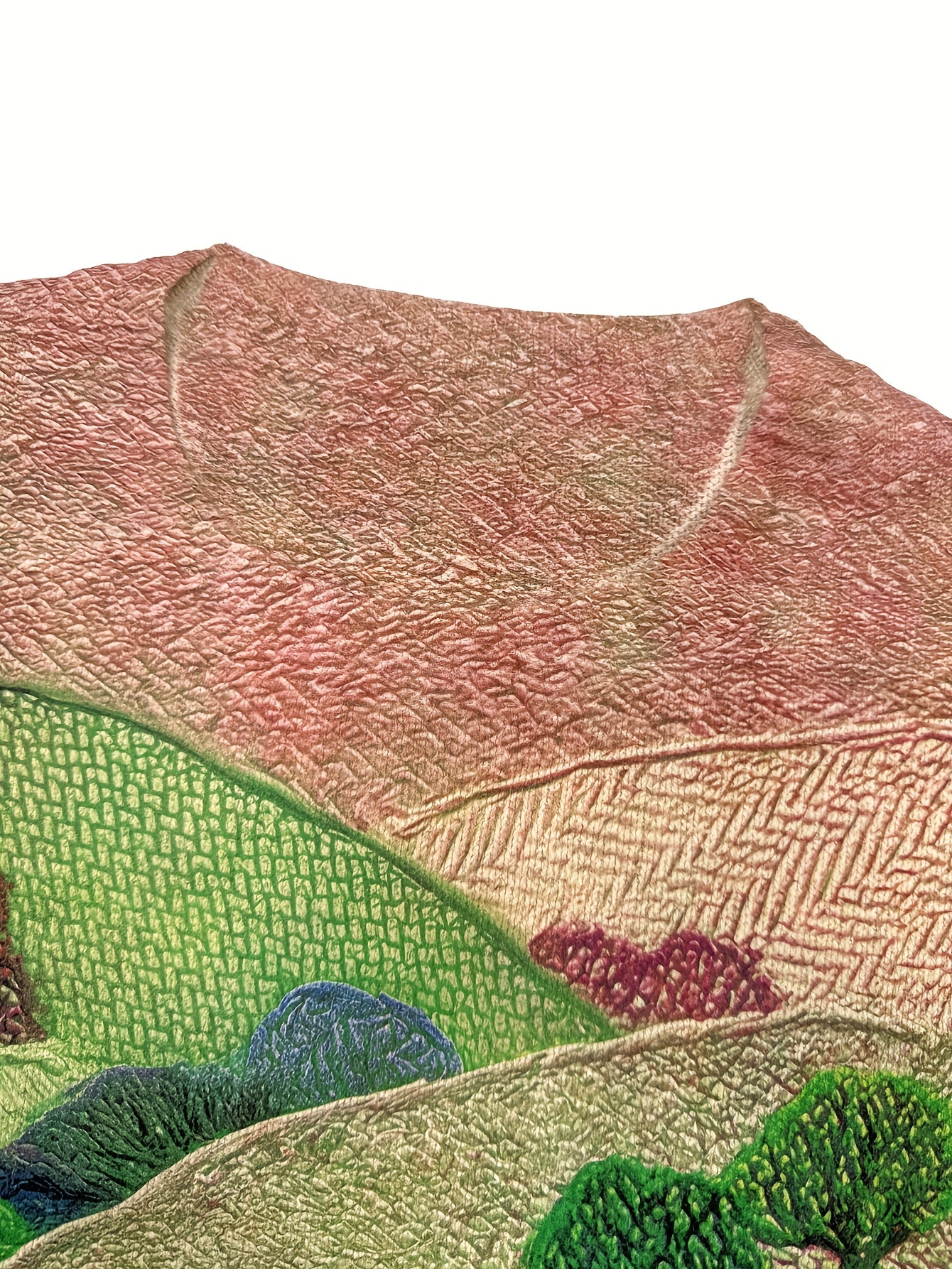 Embroidered landscape with mountains and trees on a white background