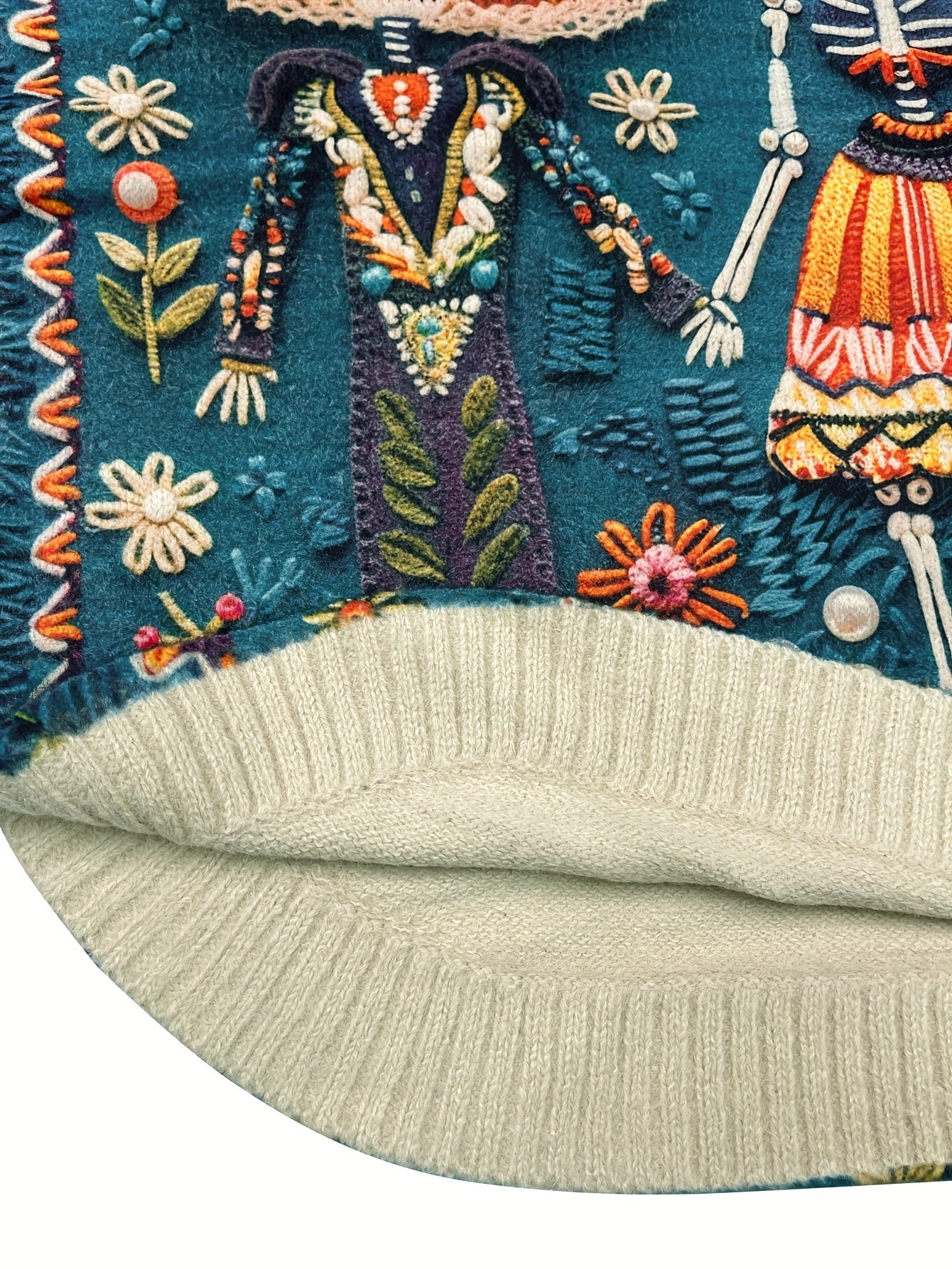 Embroidered fabric with colorful designs on a white background