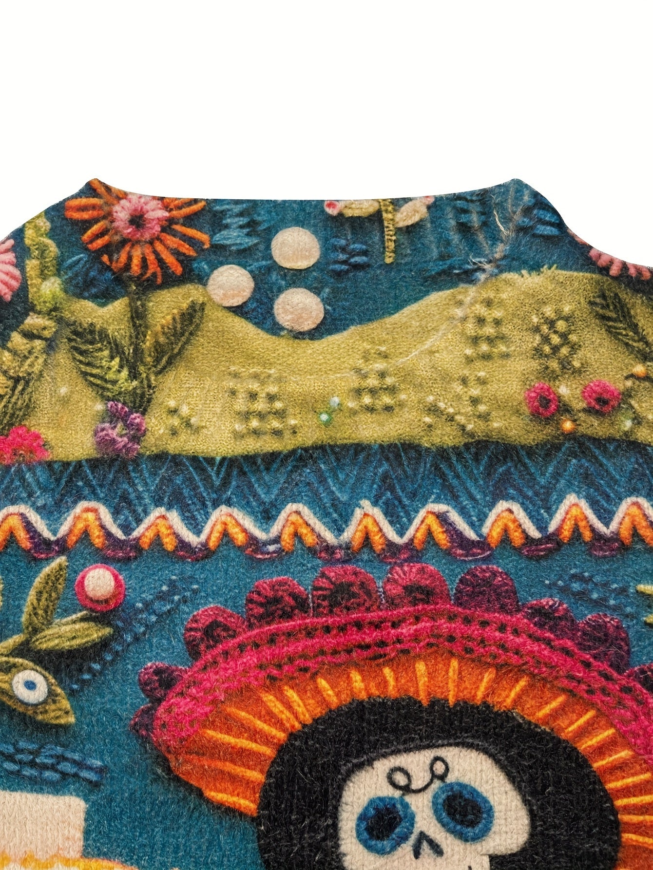 Colorful embroidered design with a skull wearing a sombrero on a white background