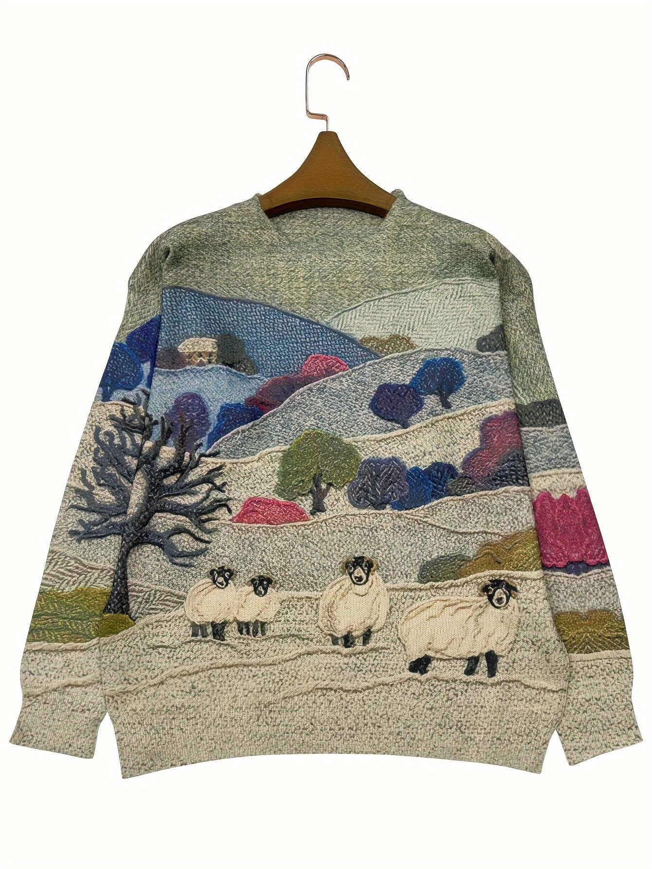 Knitted sweater with a landscape design featuring sheep on a hanger against a white background