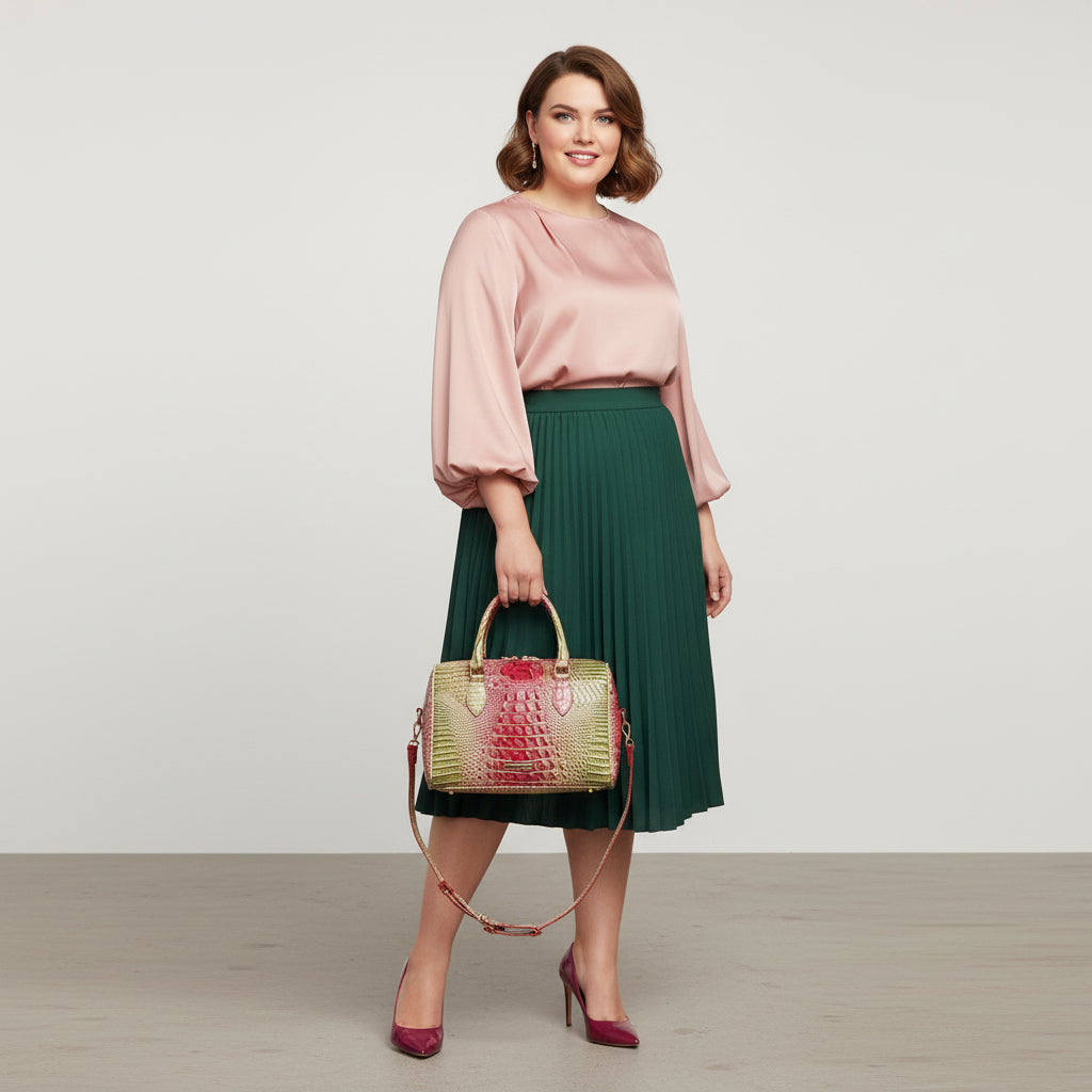 Two-tone handbag with red and green crocodile texture on a wooden surface.