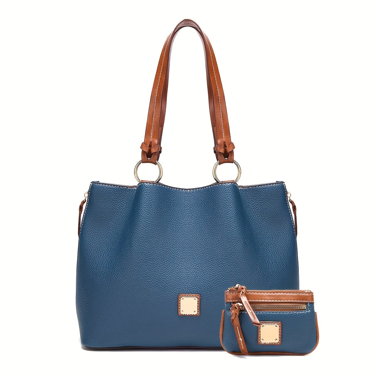 Blue handbag with brown leather handle and matching wallet on a white background