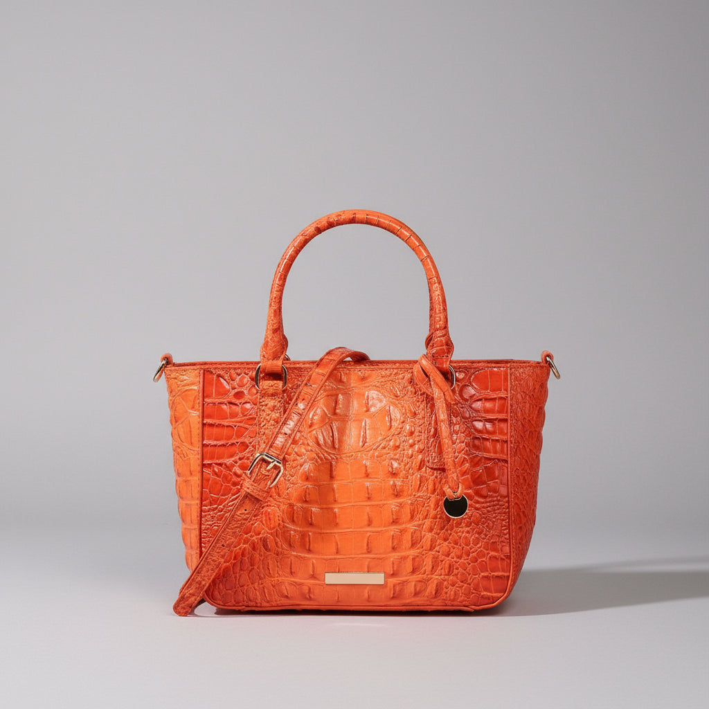 Orange textured handbag on a dark background