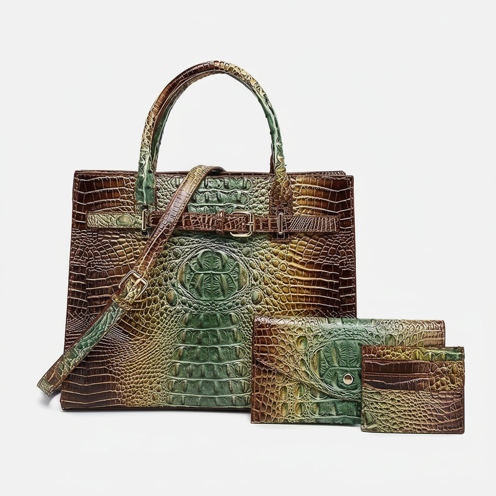 Crocodile embossed handbag and wallet set on a white background