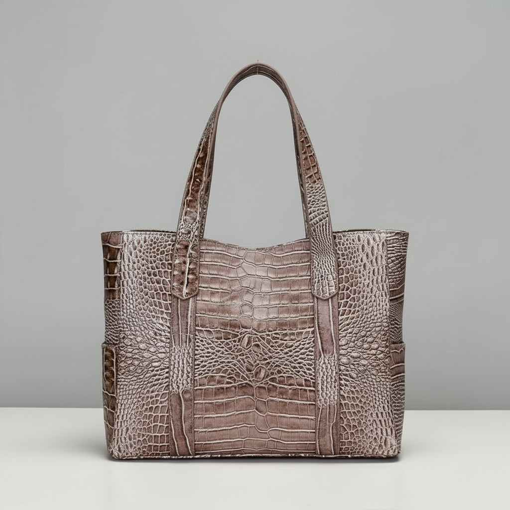 Brown textured handbag on a light gray background with a close-up inset showing pattern irregularities.