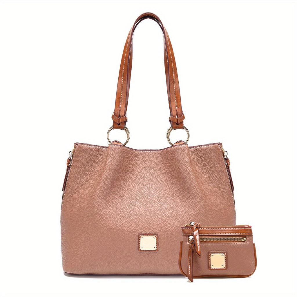 Brown leather handbag with matching wallet on a white background