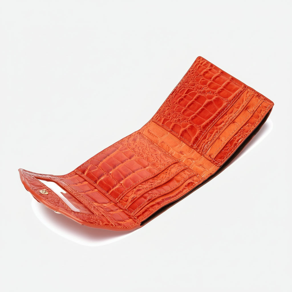 Orange textured wallet on a grey background