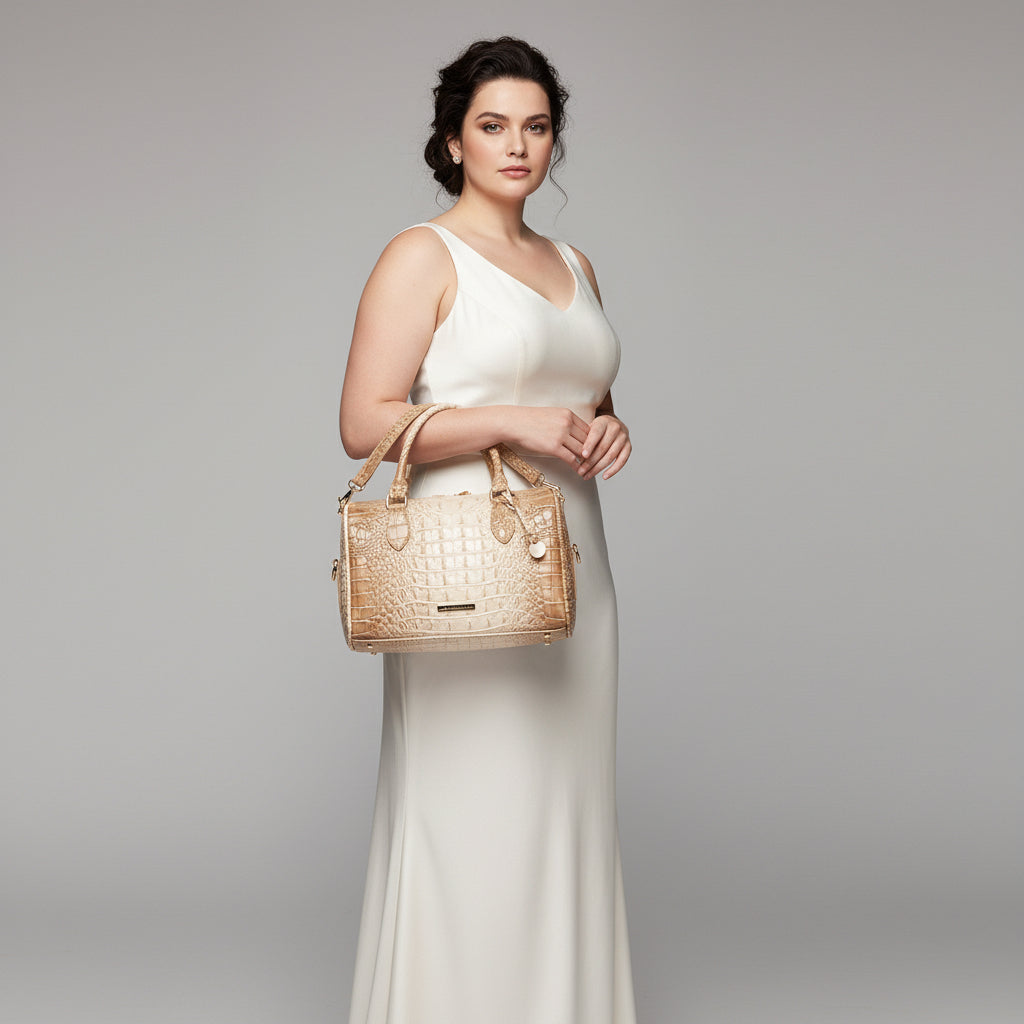 Beige crocodile-patterned handbag on a dark background