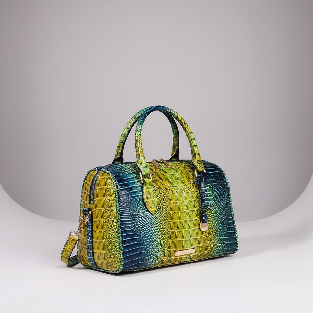 Green and blue crocodile pattern handbag on a dark background