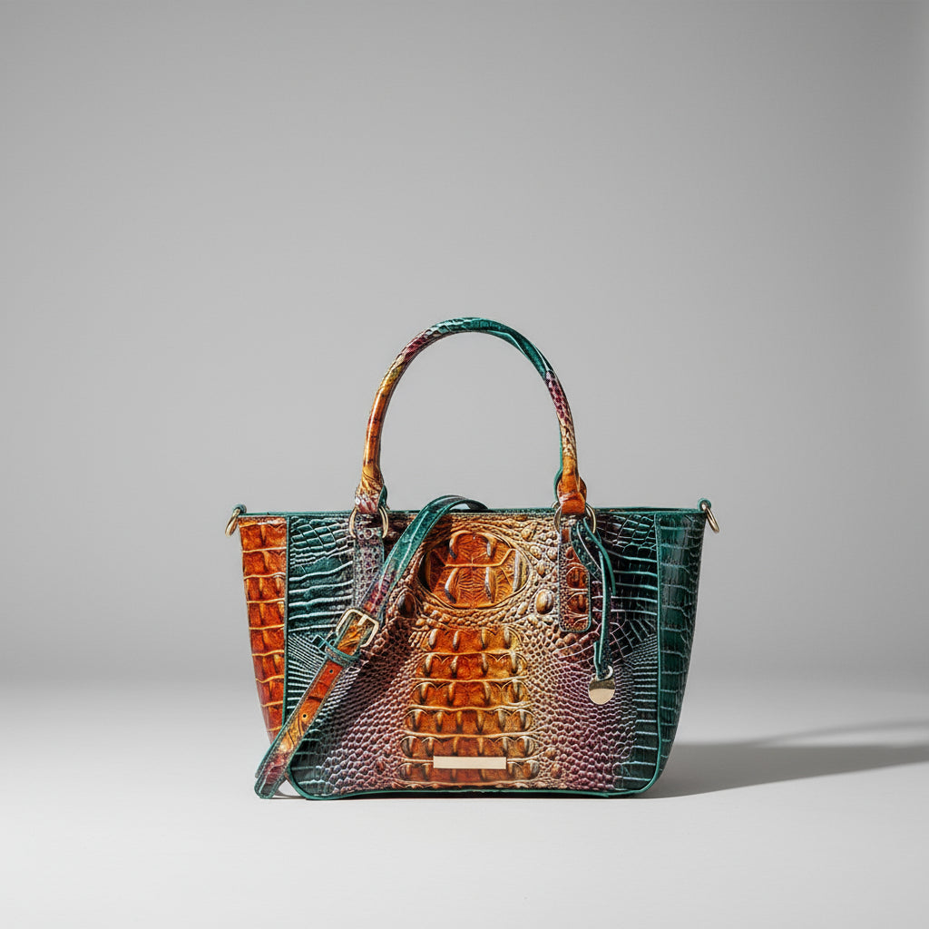 Multicolored handbag with crocodile texture on a gray background
