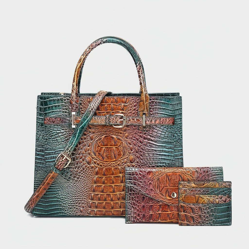 Multicolored crocodile-patterned handbag and wallet on a light gray background
