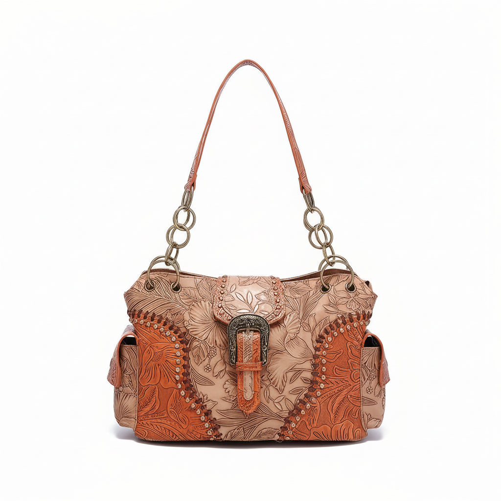 Brown leather handbag with floral patterns and a decorative buckle on a white background.