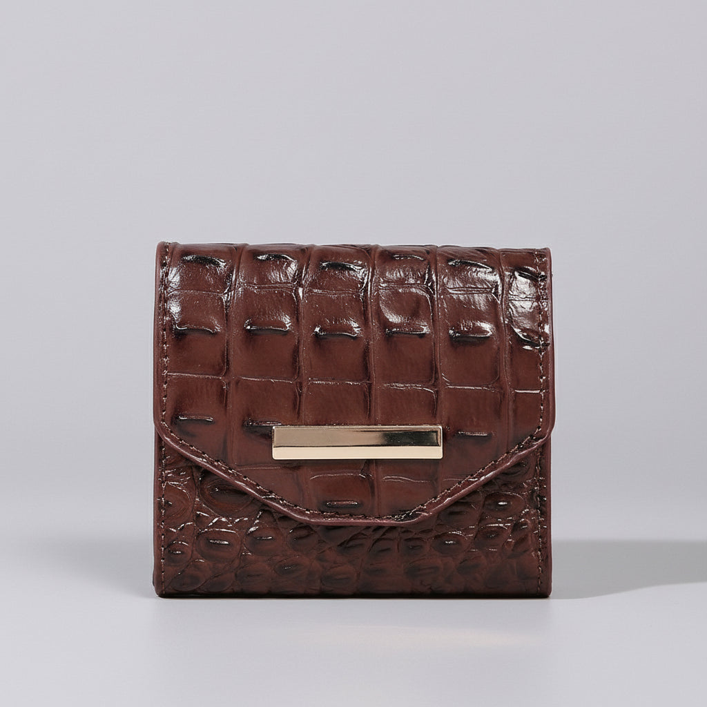 Brown textured wallet with a gold accent on a light surface.