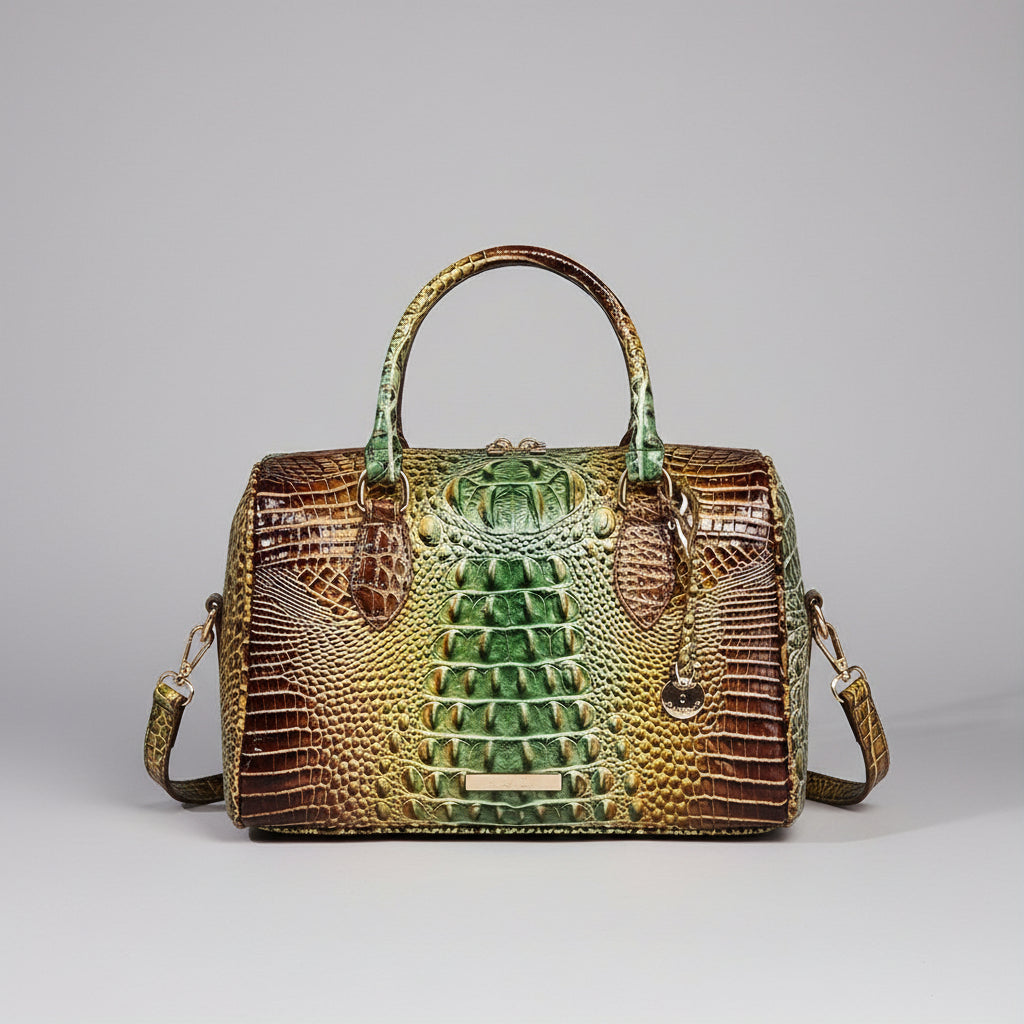 Multicolored handbag with crocodile texture on a wooden surface