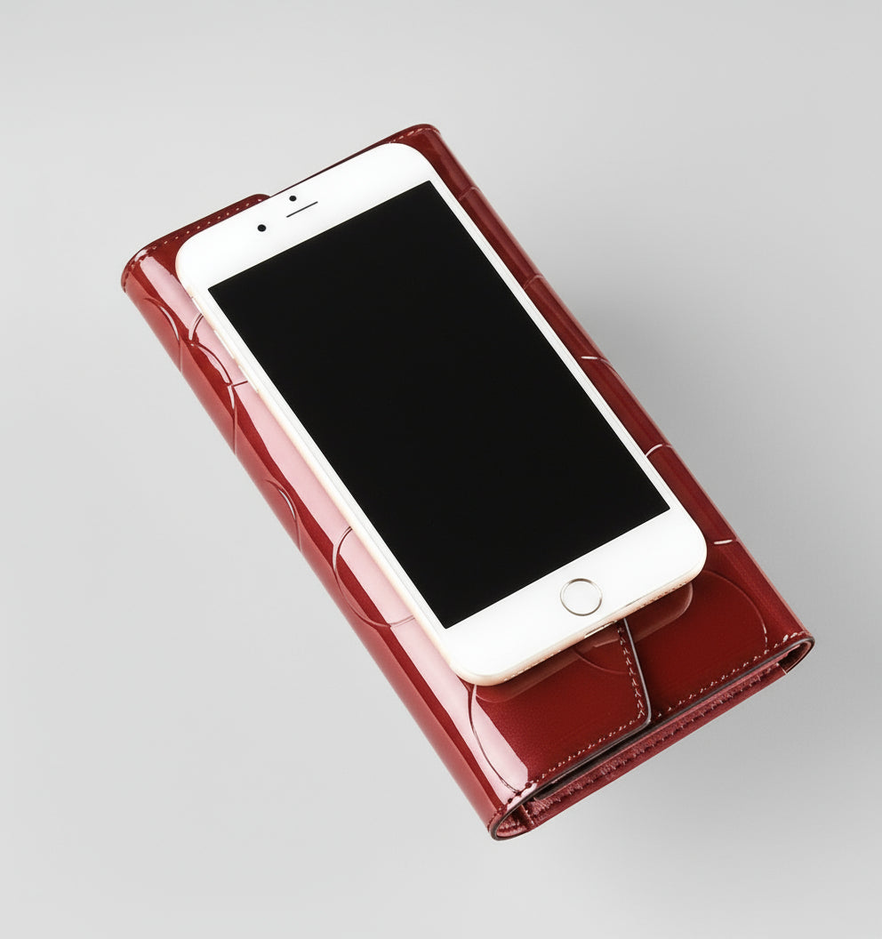 Phone case being held by a hand on a beige background