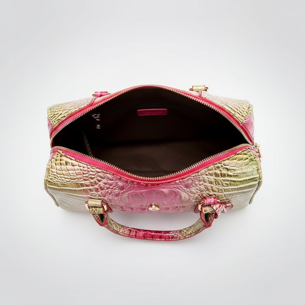 Pink and gold handbag with open top on a white background