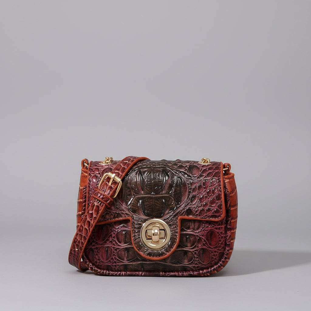 Brown textured handbag on a wooden surface with a dark background