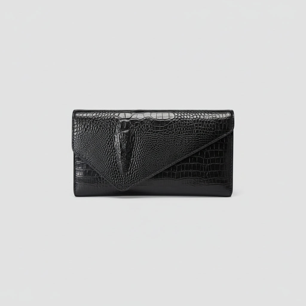 Black crocodile-patterned clutch bag on a light gray background