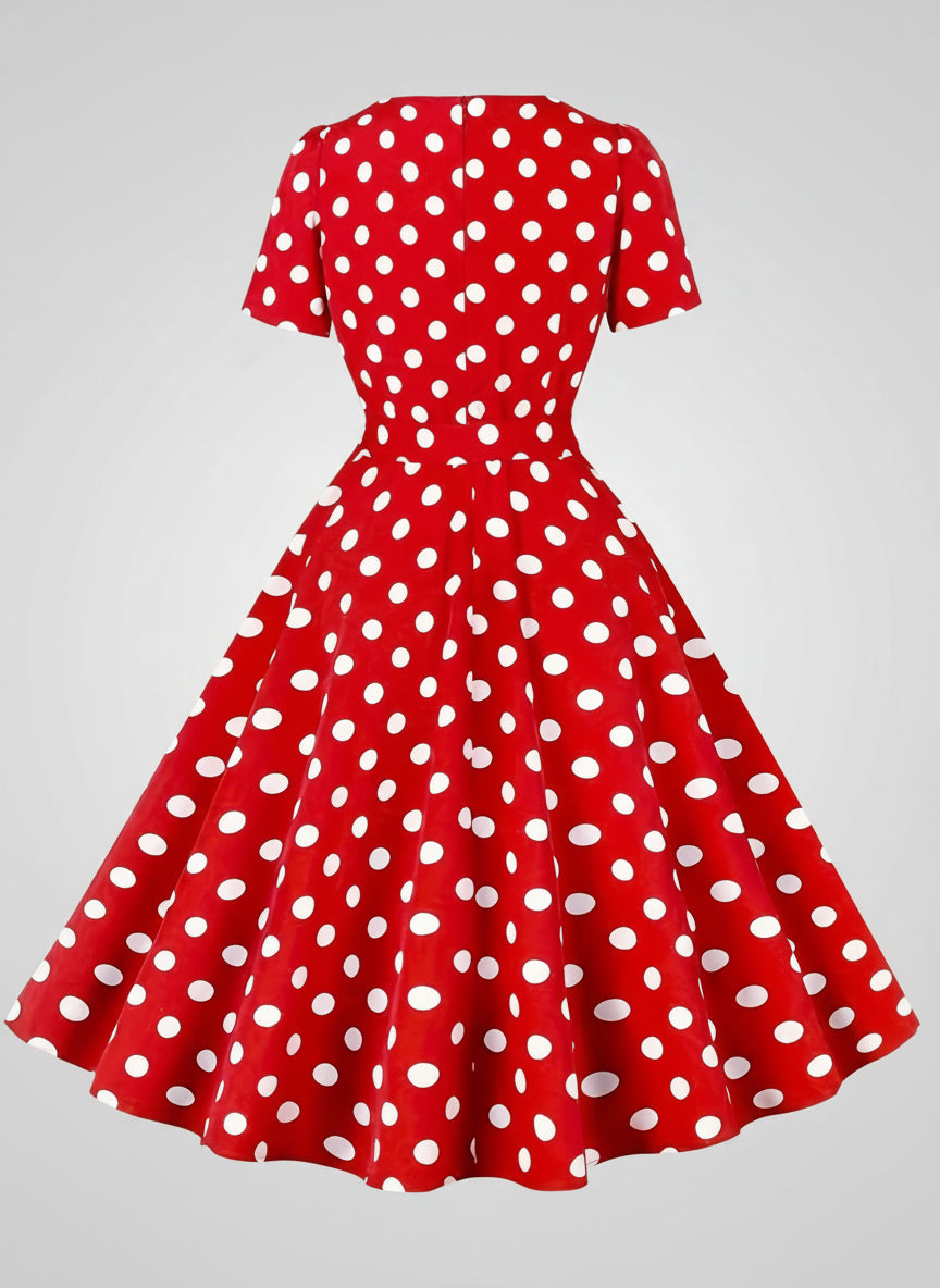 Red dress with white polka dots on a white background