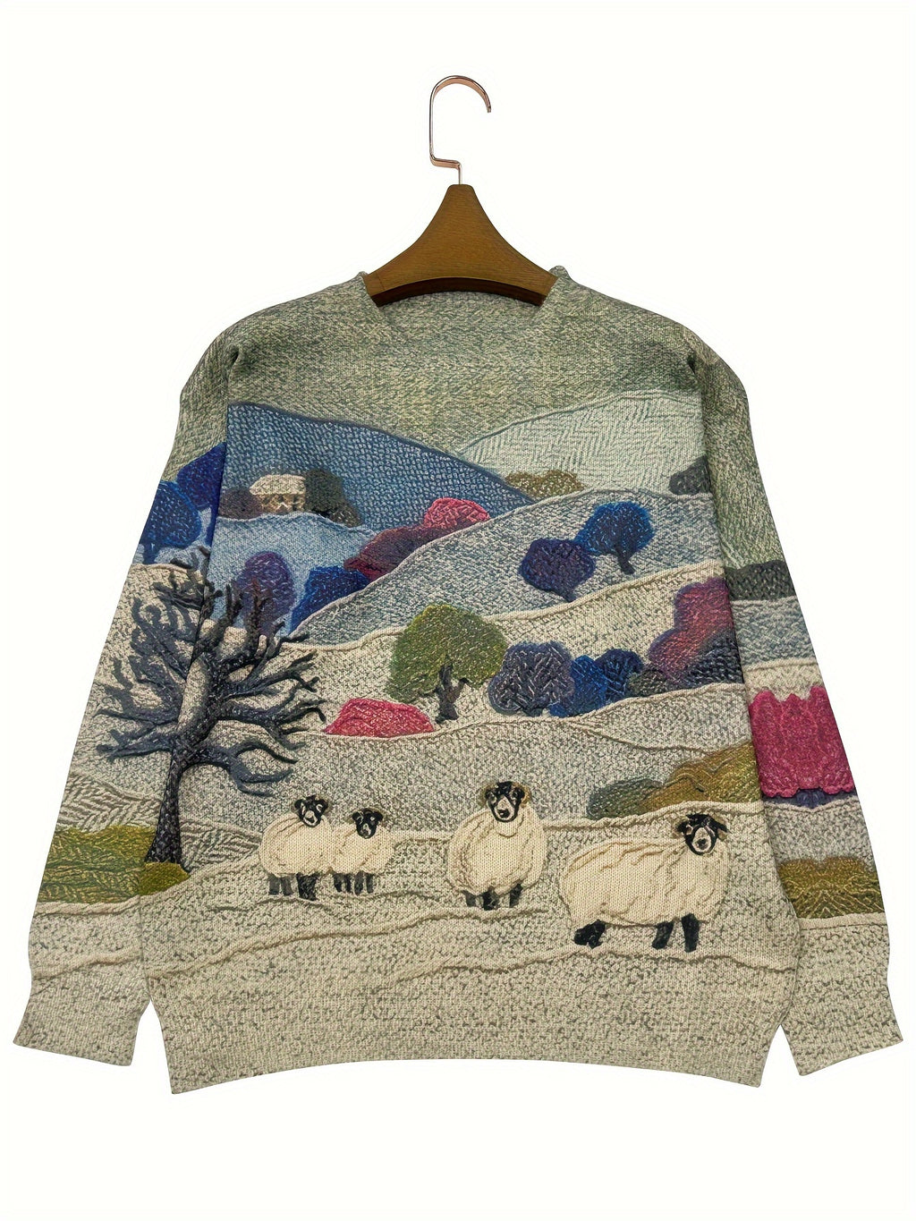 Knitted sweater with a landscape design featuring sheep on a hanger against a white background