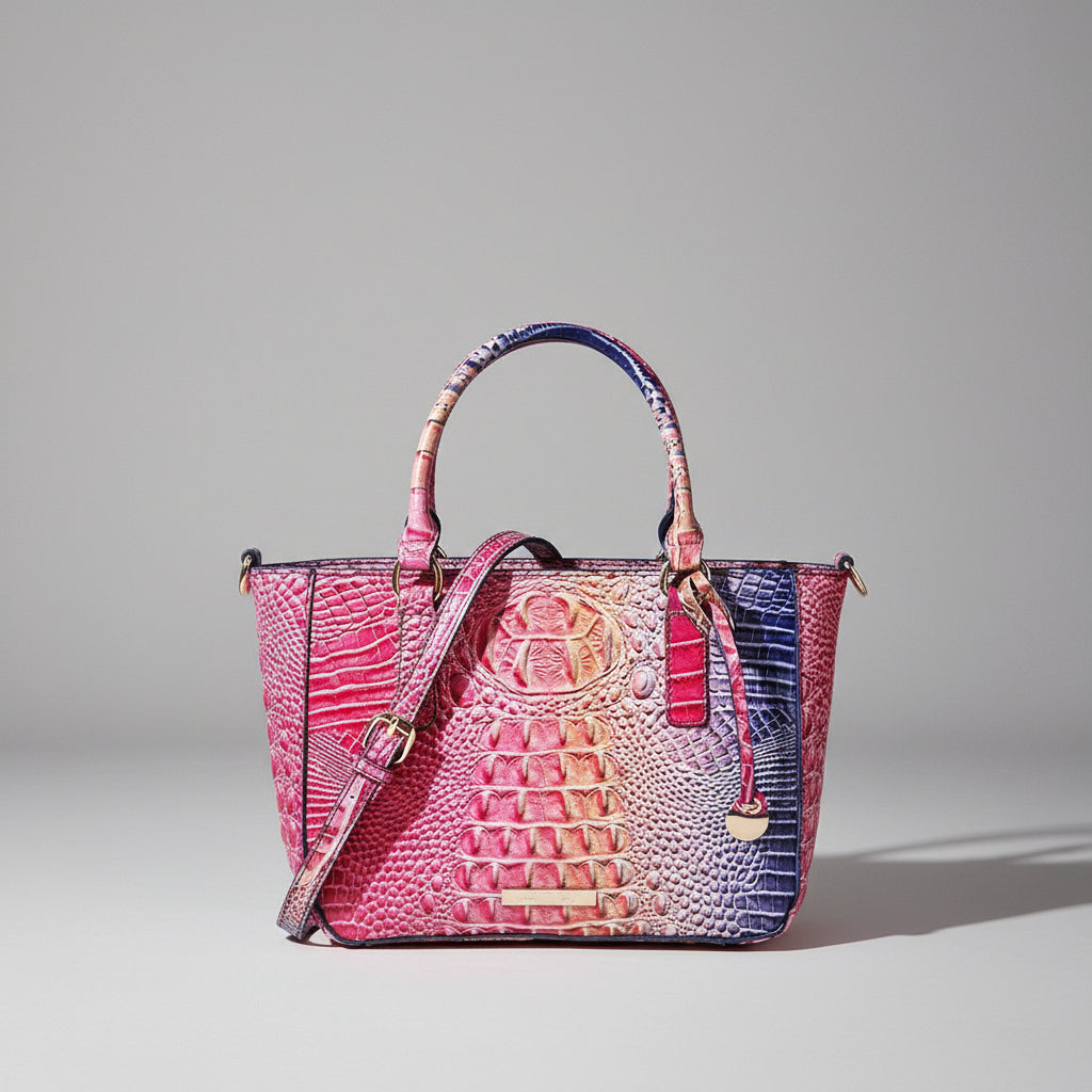 Multicolored textured handbag with a wooden box and driftwood on a dark background