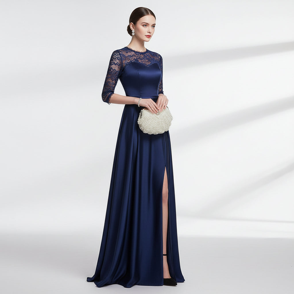 Pearl-handled clutch bag held by a hand with pink nail polish on a neutral background